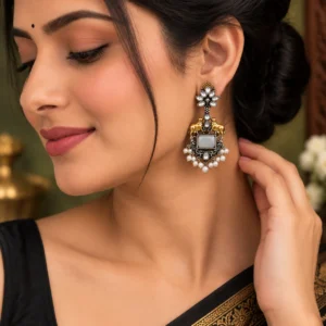 Two-tone Nandi earrings worn by Indian model