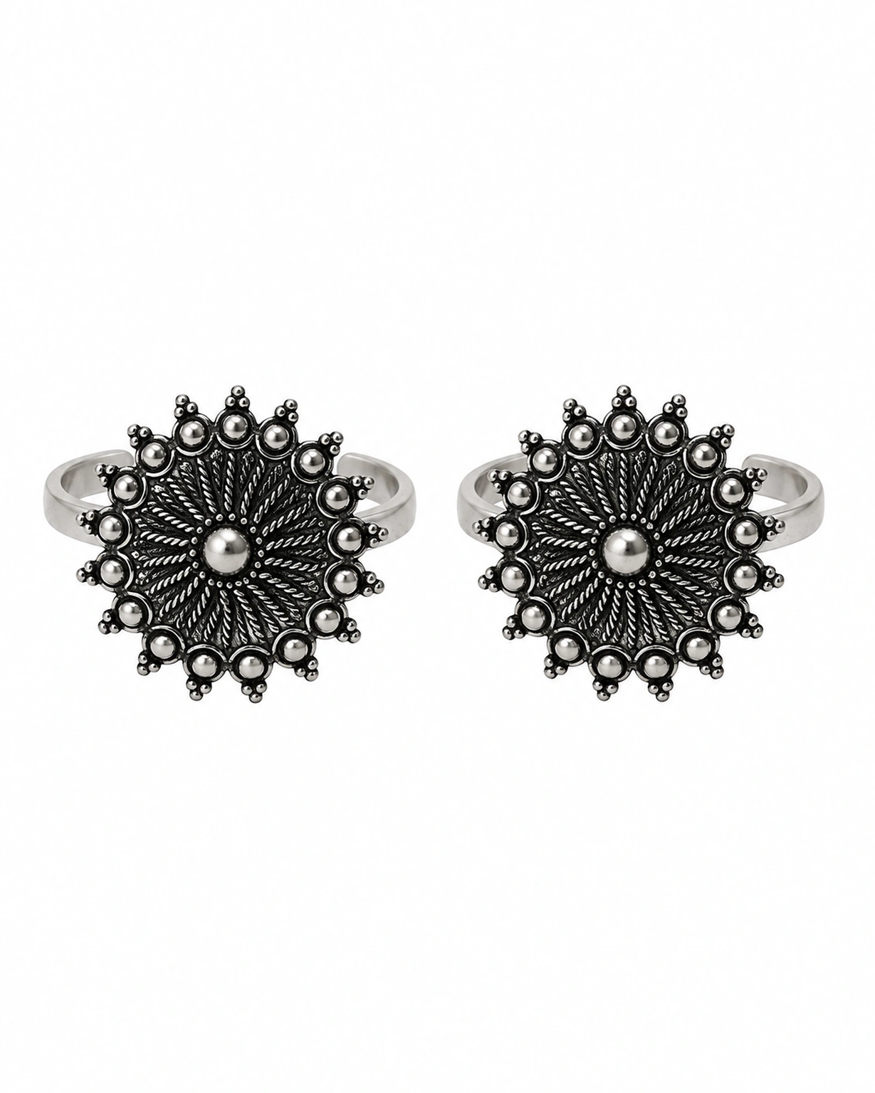 Matching adjustable oxidised toe rings on a plain white background