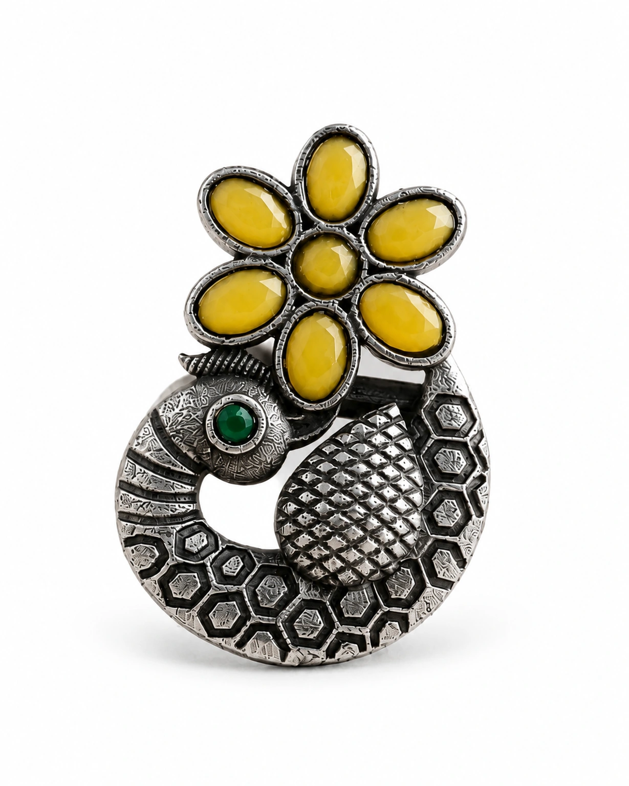 Yellow-green designer peacock ring isolated on a plain white background.